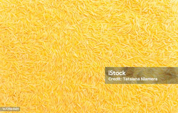 乾燥リゾーニオルゾーパスタの背景テクスチャーイタリア料理リゾットとサラダ用のデュラム小麦セモリナパスタご飯の形をしたオルゾーパスタ接写水平面上面図平ら - イタリア料理のストックフォトや画像を多数ご用意