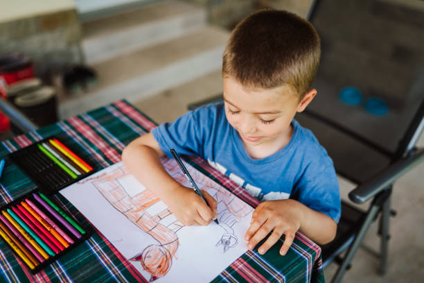 Cute boy drawing