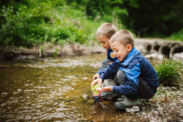 istock Twin boys playing in the nature. 1472964222