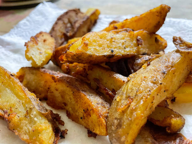 istock Close up image of fried potato wedges 1472964487