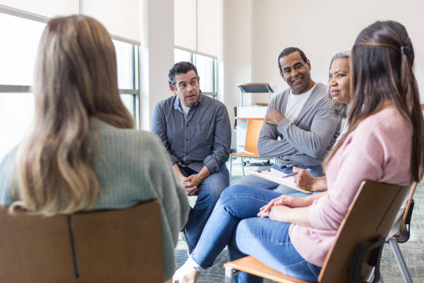 istock Diverse group of colleagues sit together to brainstorm ideas 1472972305