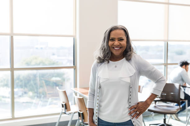 istock University counselor smiles for the camera with her hand on her hip 1472972332