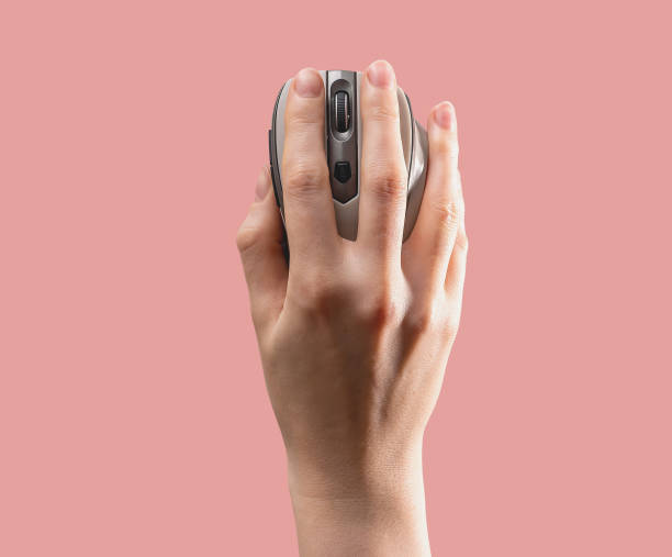 Hand on wireless computer mouse, top view. Search, surfing internet concept