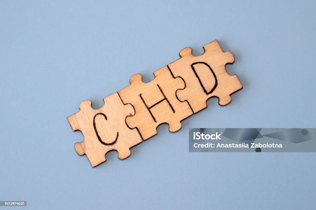CHD word written on wooden puzzles on blue background. Healthcare conceptual for hospital, clinic and medical busines. CHD acronym coronary heart disease CHD word written on wooden puzzles on blue background. Healthcare conceptual for hospital, clinic and medical busines. CHD acronym coronary heart disease. Abdomen Stock Photo
