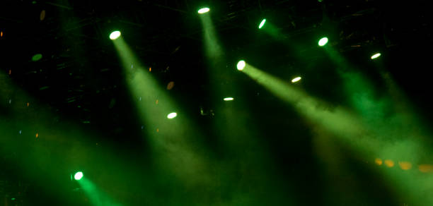 istock abstract magic image with rays of colored light from the spotlights in the dark 1472975533
