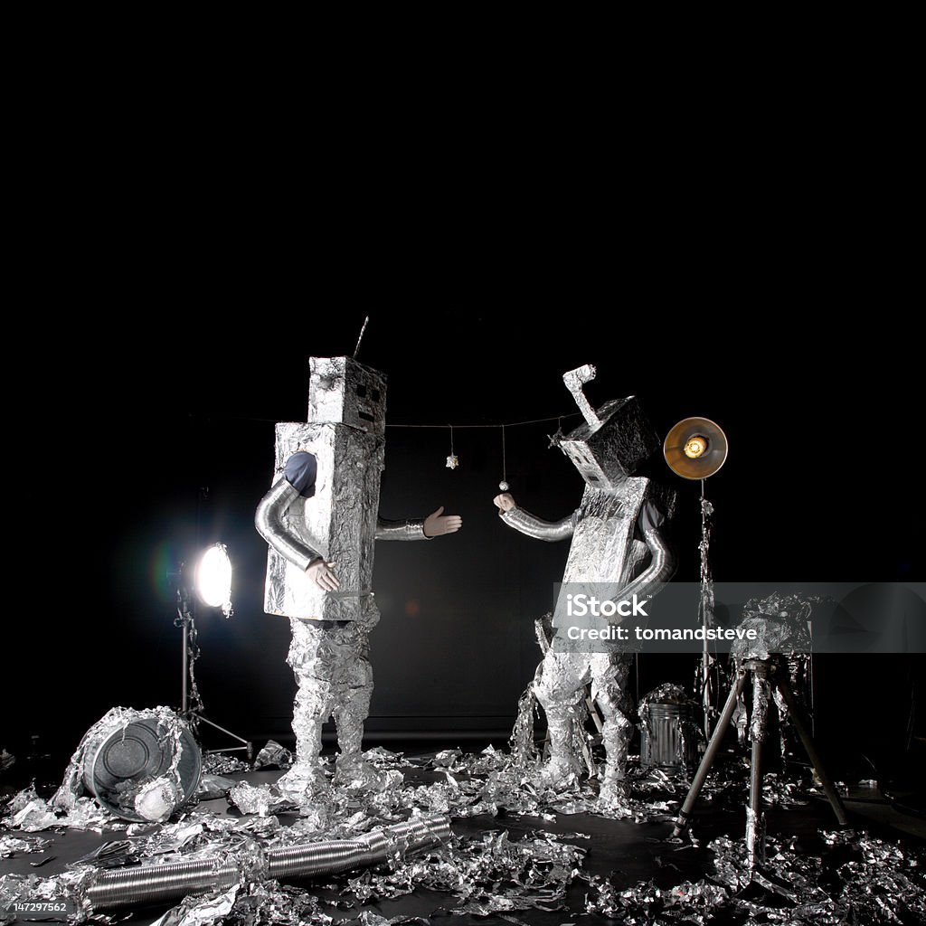 Dancing Tin Foil Robots celebrating lunar landing in style Dancing tin foil robots celebrating lunar landing in  style. Aluminum Stock Photo