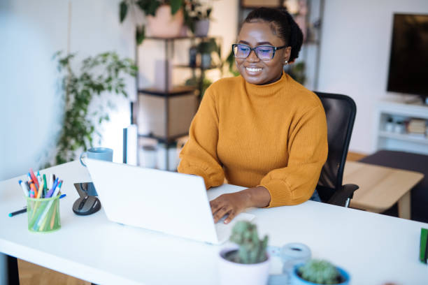 istock African entrepreneur working in office on laptop 1472977090