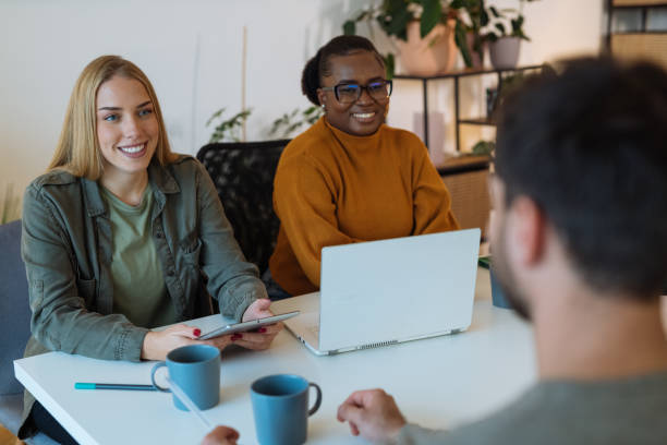 istock Team of young diverse entrepreneurs working together 1472977596