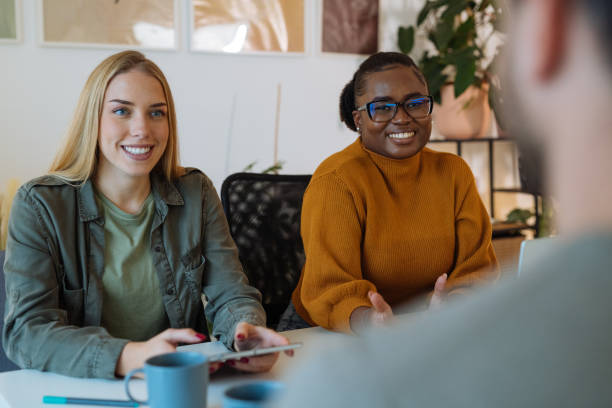 istock Team of young diverse entrepreneurs working together 1472977598