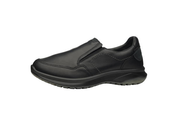 istock Leather black men elasticated sneakers without laces isolated on white background. Modern sports casual shoes with rubber soles. Fashionable sneakers. Urban male fashion - stretch hipster footwear. 1472978067