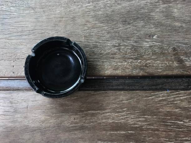 istock ashtray on wooden table 1472978094