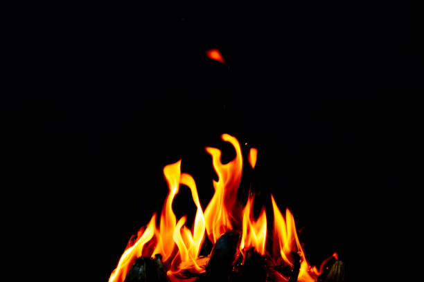 istock Fire flame glow and burning on dark black background 1472978567