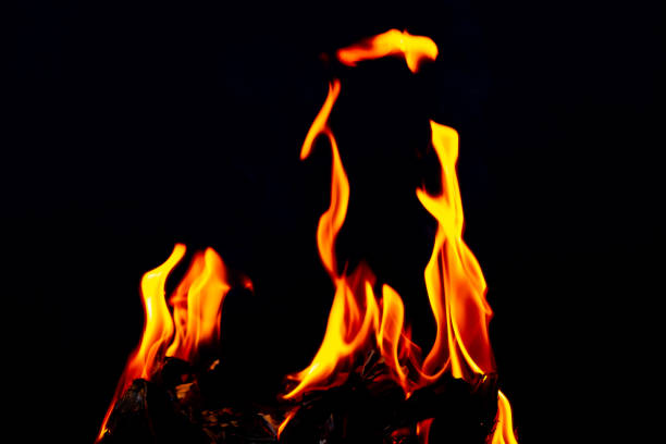 istock Fire flame glow and burning on dark black background 1472978628