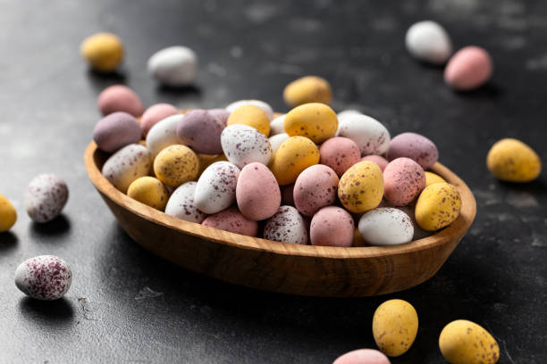istock Easter mini eggs, chocolate candy in wooden bowl 1472979803