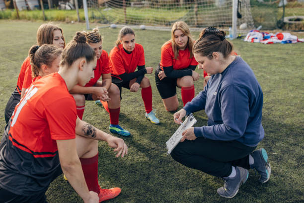 istock Female rugby team on time out 1472983395