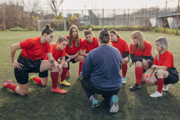 istock Female rugby team on time out 1472983453