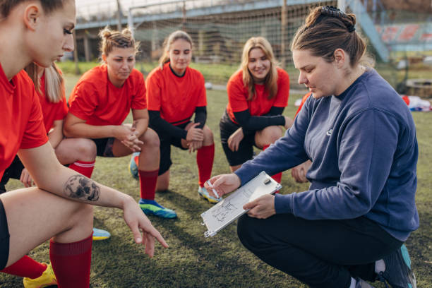 istock Female rugby team on time out 1472983752
