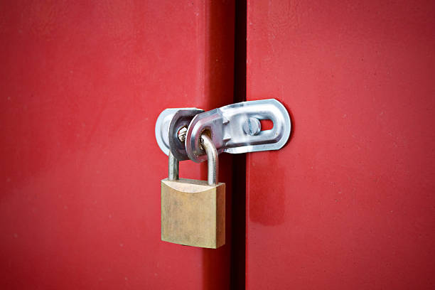 istock padlock on metal door 147298416
