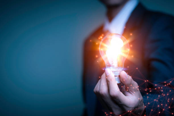 Businessman holding a light bulb, Creative new idea. Innovation, brainstorming, solution and inspiration concepts. imagination, creative thinking problem solving...