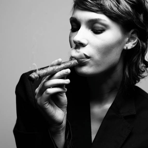 Elegant smoking woman stock photo
