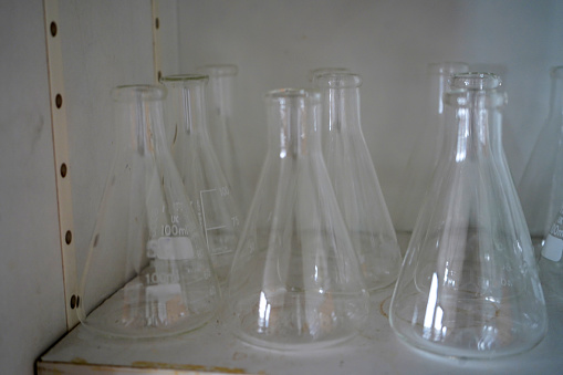 Close up of laboratory glassware on a shelf