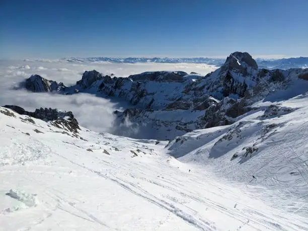Ski tour on the Säntis in the Alpstein area. Wonderful view of the snowy mountains with a sea of fog in the background. Ski mountaineering. High quality photo. Skitouring / Skitour. Appenzell