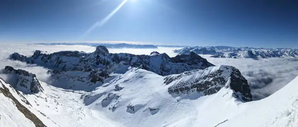Ski tour on the Säntis in the Alpstein area. Wonderful view of the snowy mountains with a sea of fog in the background. Ski mountaineering. High quality photo. Skitouring / Skitour. Appenzell