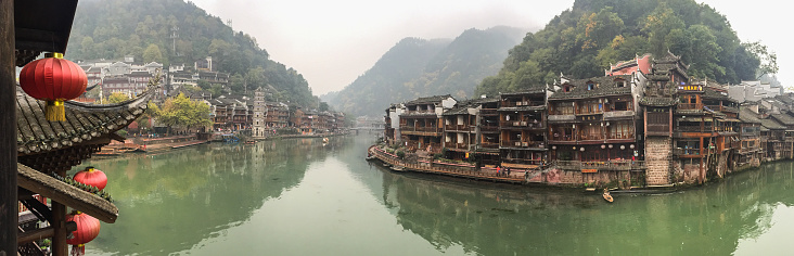 Scenery along the Yulong River near Yangshuo, Guilin in Guangxi Province, China. Bamboo rafts are moored by the river bank near Yangshuo.