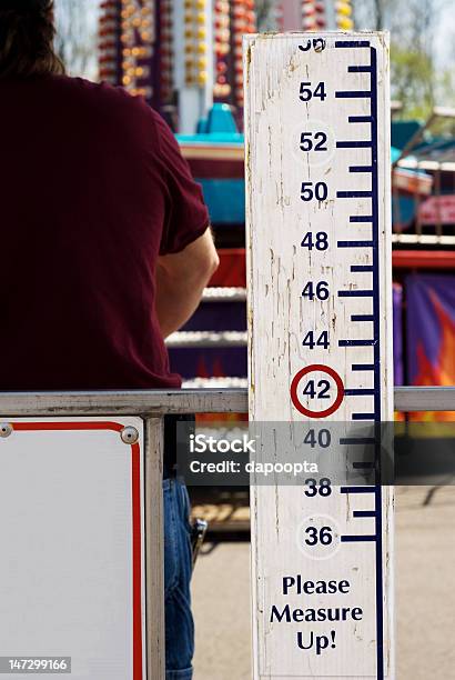 Please Measure Up Sign At Carnival Stock Photo - Download Image Now - Human Height, Amusement Park Ride, Sign