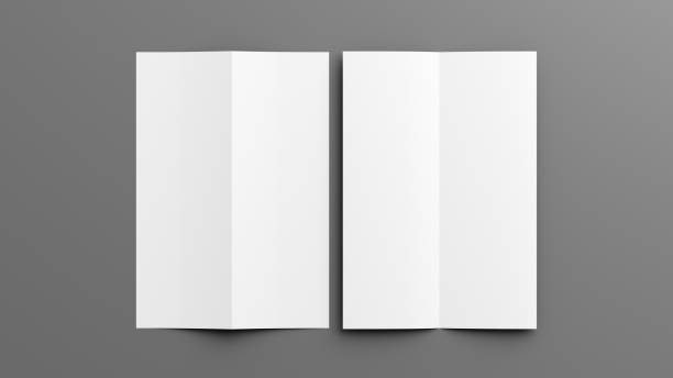 istock Half-folded flyer A4 vertical booklet mock up on gray background. View directly above 1472993041