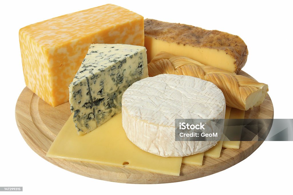 Variety of cheese being served on a wooden platter Various types of cheese on wooden platter, isolated on white background Blue Stock Photo