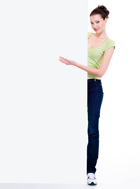 istock woman points  on the blank banner 147299394