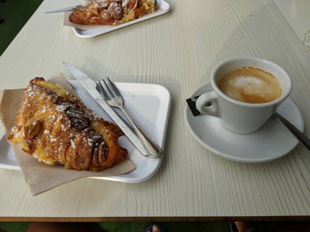 istock Delicious breakfast with fresh croissants and coffee 1472998594