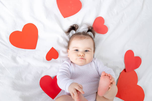 istock baby with red hearts, valentine's day concept 1472999212