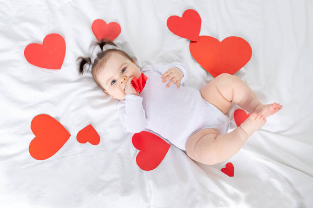 istock baby with red hearts, valentine's day concept 1472999354
