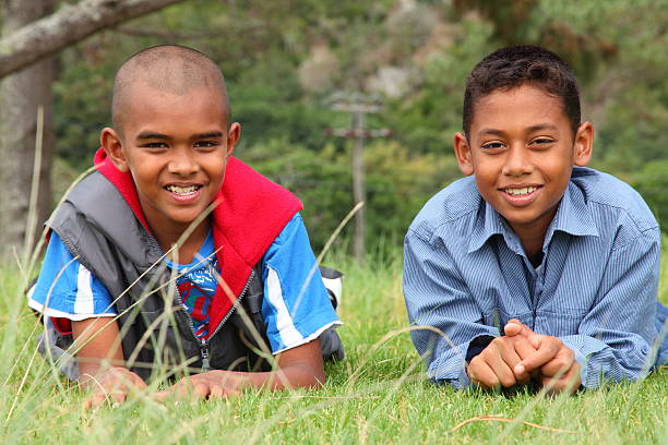 istock Young school friends lying on the grass in a park 147300471