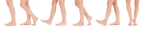 Set of white legs thigh down in various states of walking stock photo