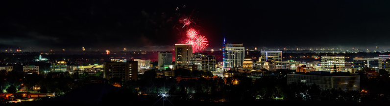 Night skyline of Boise during Independence Day fireworks