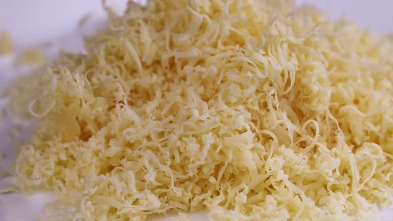 Hard cheese with holes grated into thin small slices