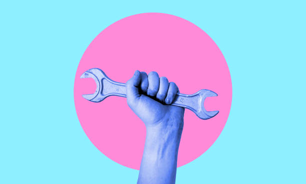 istock Art collage. Hand with a wrench in neon. 1473009525