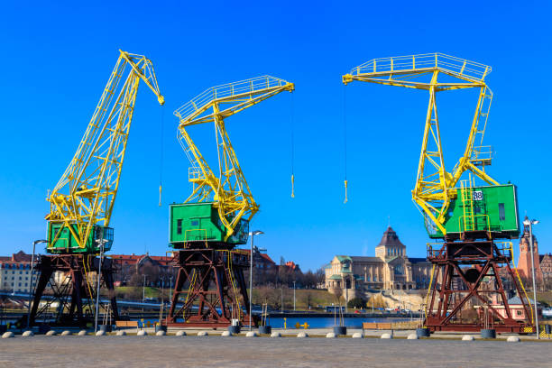 istock Old cranes on city boulevard in Szczecin, Poland 1473011133
