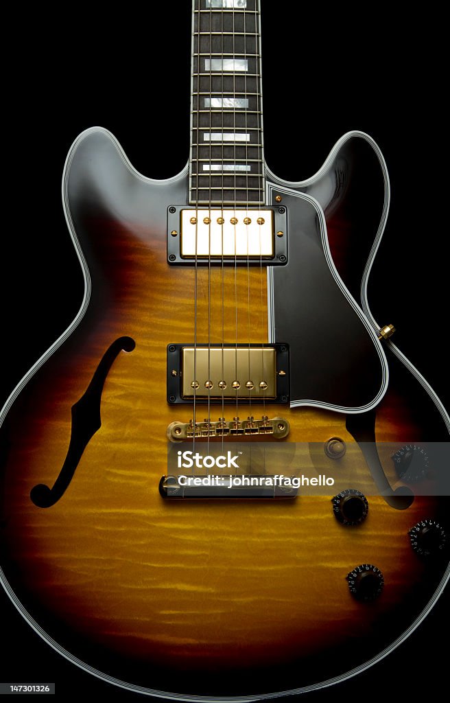 Guitar Crop Vintage guitar with sunburst finish isolated on black Acoustic Guitar Stock Photo