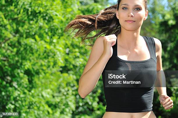 Young Woman Running In Green Park Stock Photo - Download Image Now - Active Lifestyle, Activity, Adult