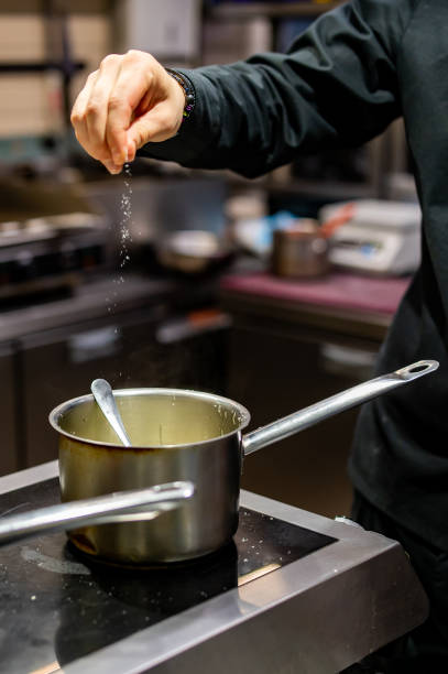 istock Chef hands cooking sauce in the restaurant kitchen 1473013355