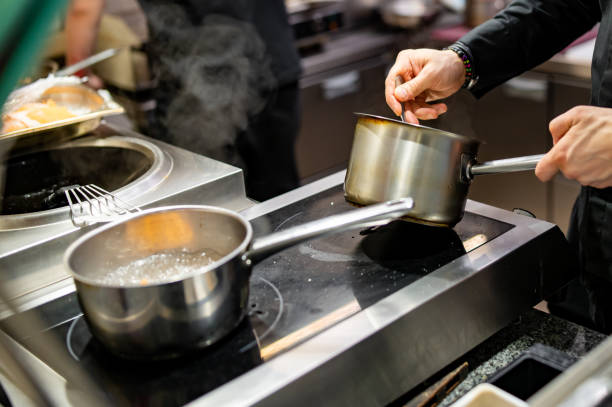 istock Chef hands cooking sauce in the restaurant kitchen 1473013356