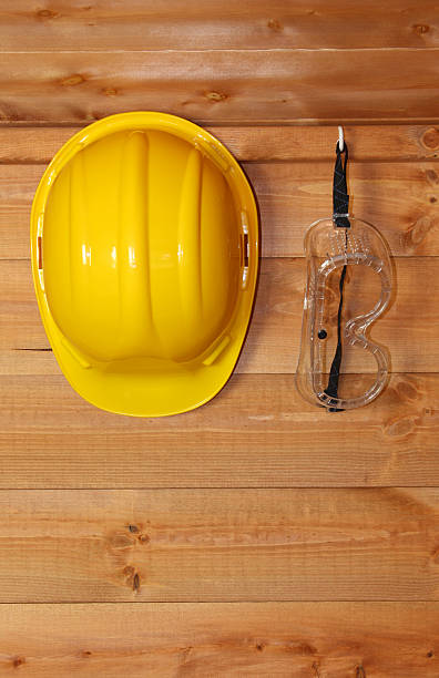 Hard hat and safety goggles stock photo