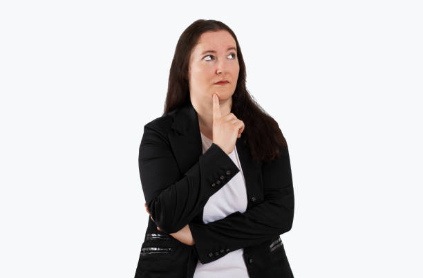 istock pensive business woman looking up 1473016024