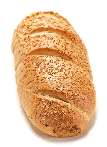 White bread loaf with sesame on white