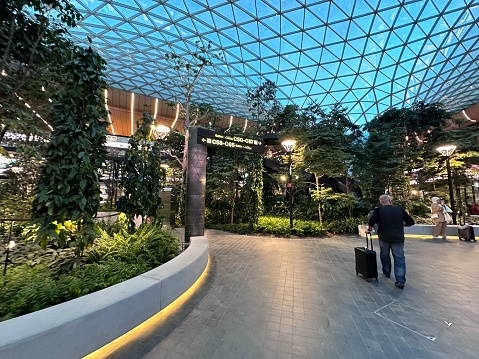 Doha, Qatar - February 10, 2023: Hamad International Airport (DOH) expands with indoor tropical garden.