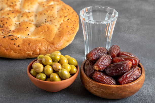 ramadan pita, dates fruit and green olives.islamic iftar table - close up directly above holiday nobody imagens e fotografias de stock